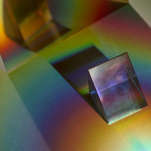 Light leak effect on a triangular prism wallpaper background